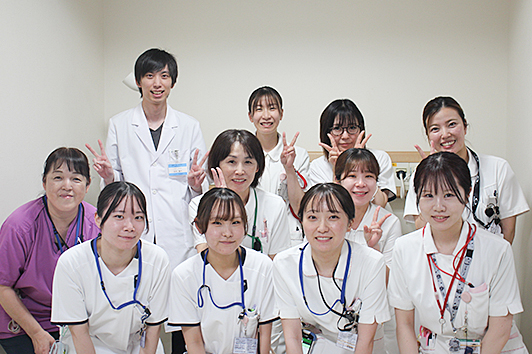 5B����
