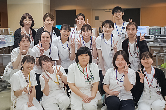 6B����